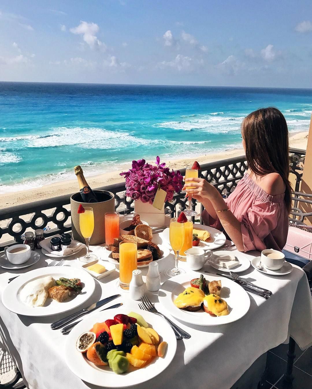 girl having breakfast at beach resort