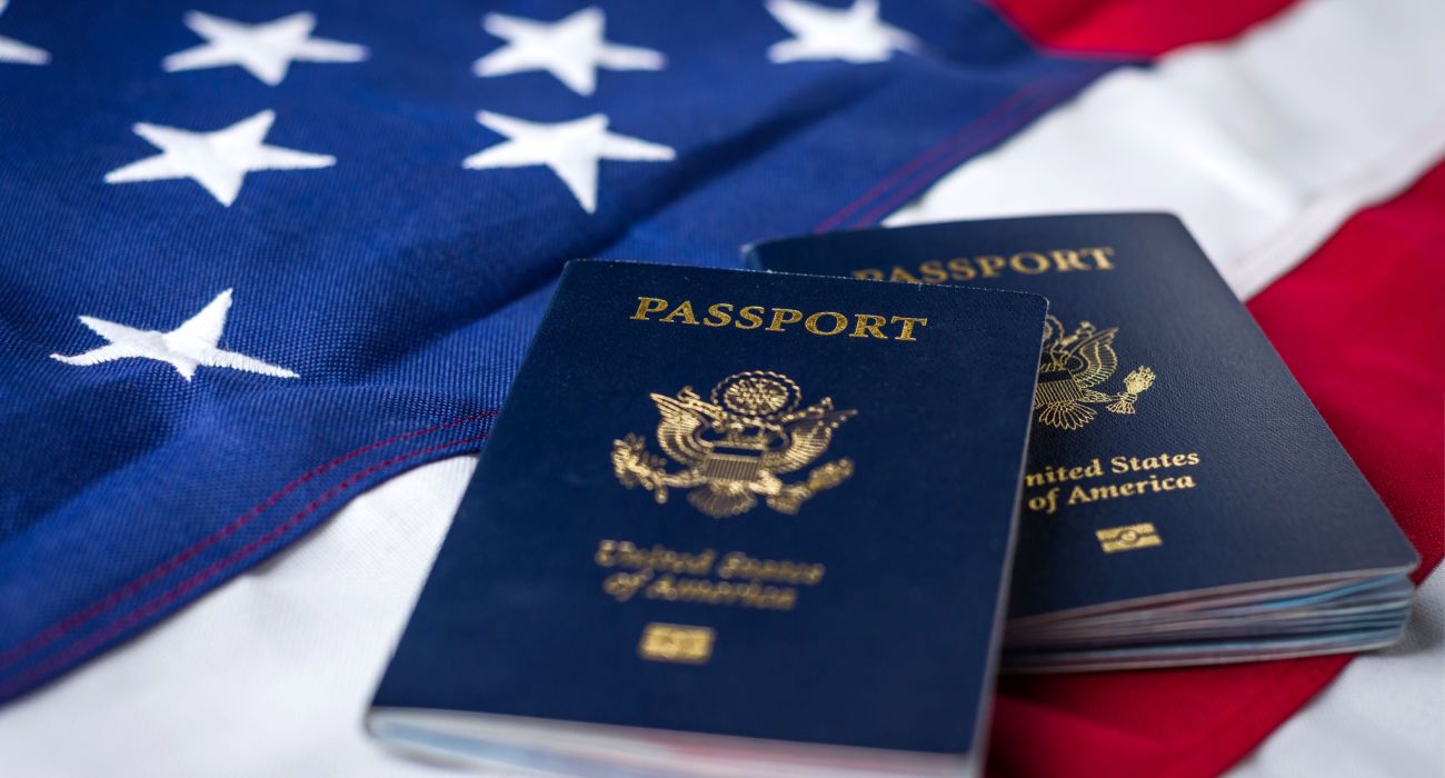 United States Passports on top of an American Flag