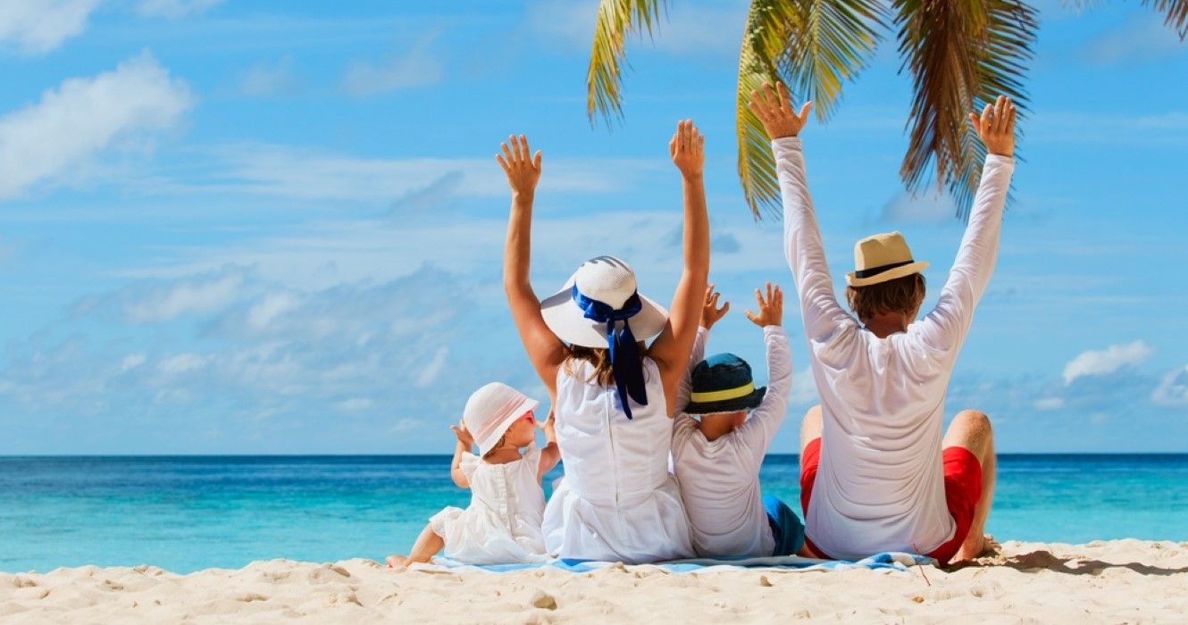 Happy family with kids on the beach