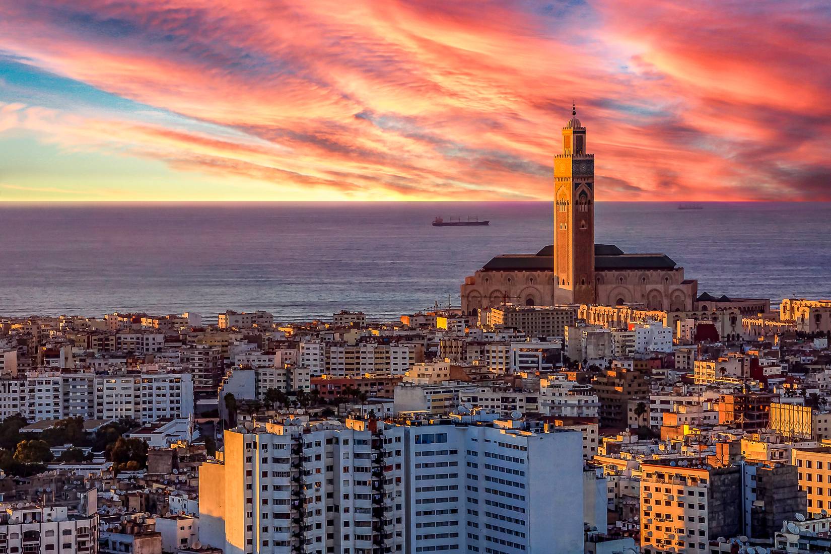 Sunset view of the city of Casablanca with the third largest mosque in the world, Hassan II Mosque in Casablanca, Morocco