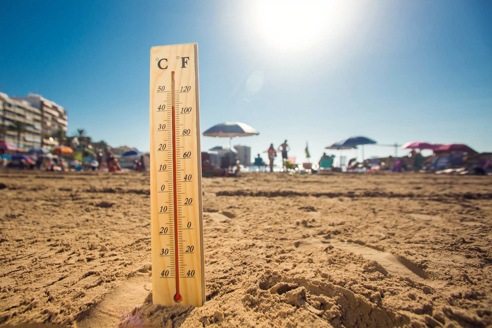 Hot weather. A temperature scale on a beach shows high temperatures during a heat wave. Hot summer and climate concept