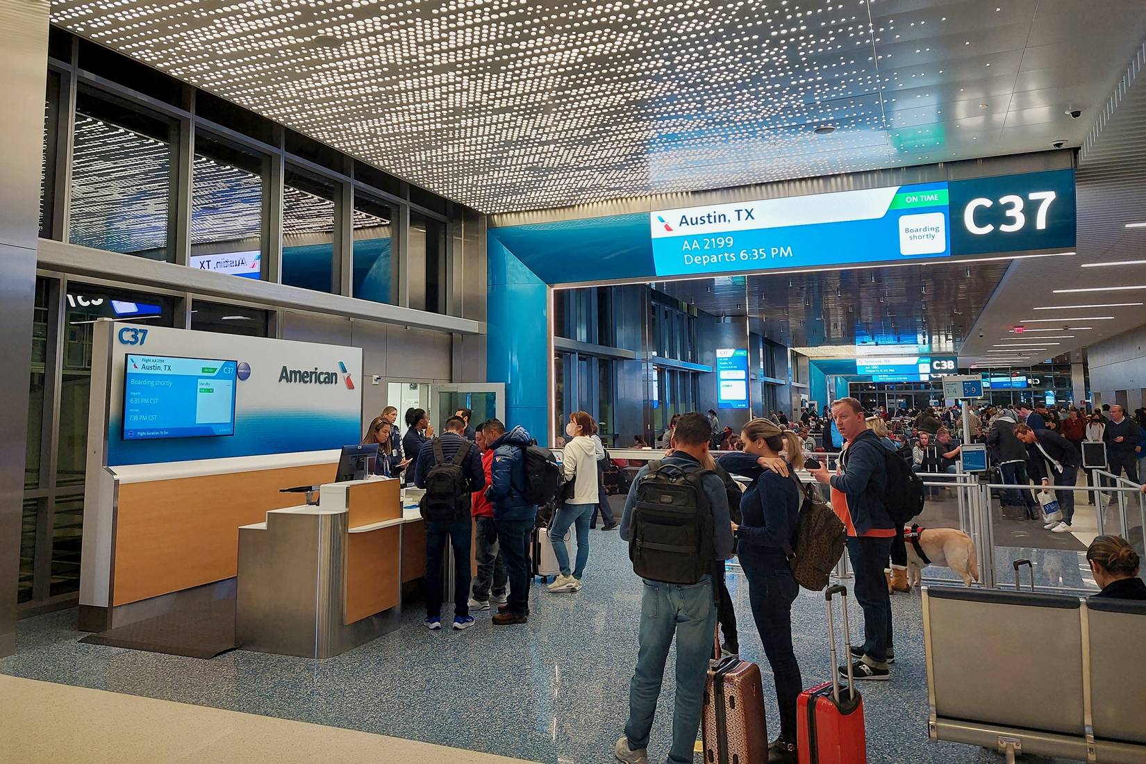 Passengers prepare to board an American Airlines flight to Austin, Texas at Gate C37 at Dallas Fort Worth International Airport (DFW)