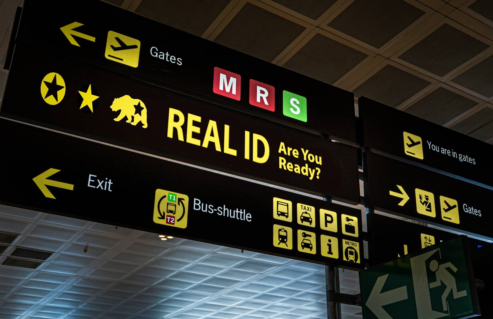 Sign displaying Real ID compliance, reminding passengers at a U.S. airport of new travel document requirements