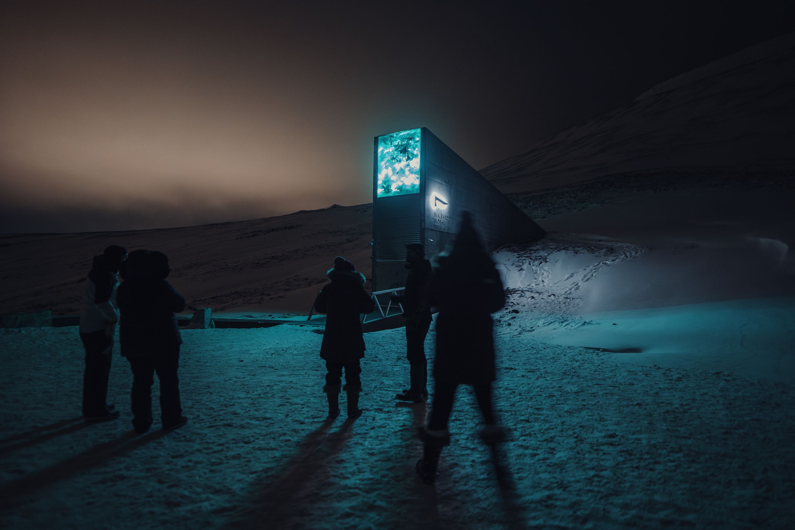 View of a tour group in front of the Svalbard Global Seed Vault, Svalbard, Norway