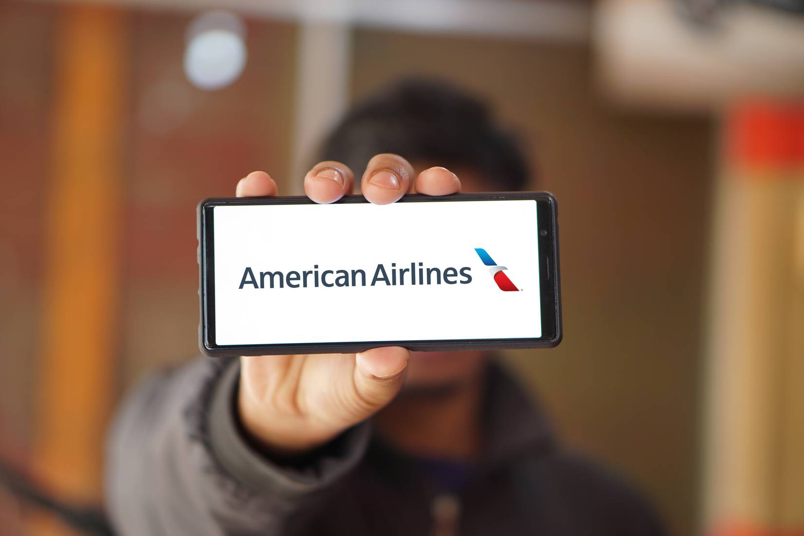 View of American Airlines logo is displayed on a smartphone screen.