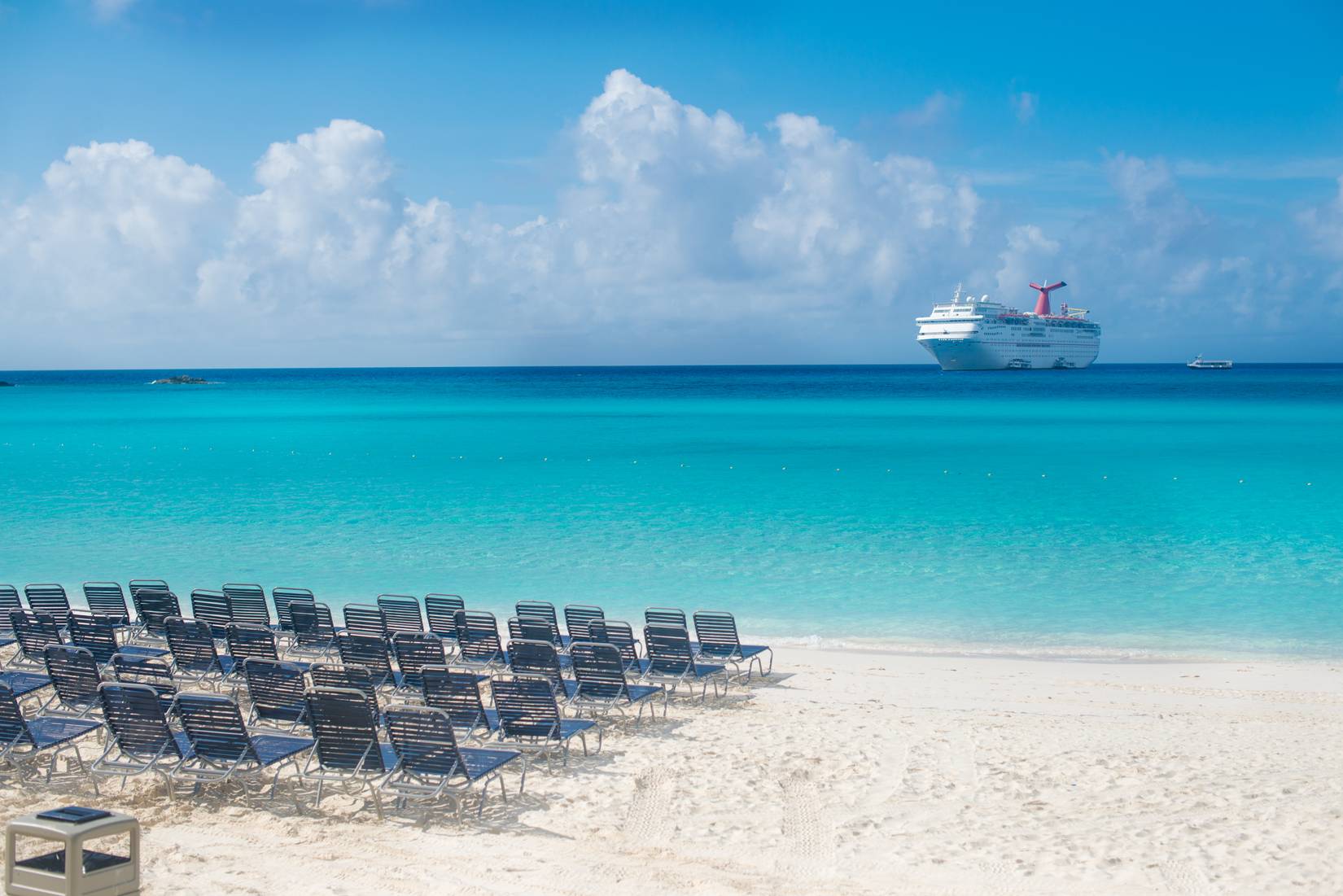 Carnival Fantasy cruise ship tendered near Half Moon Cay in The Bahamas.