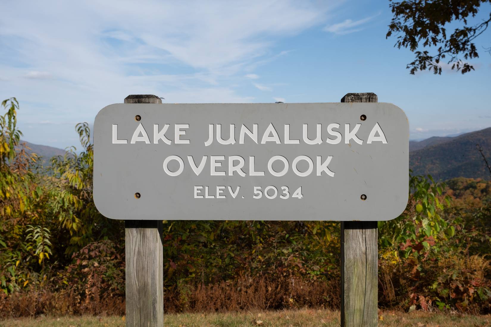 View of the Lake Junaluska Overlook signpost showing elevation 5034 ft. on the Blue Ridge Parkway, North Carolina, NC, USA