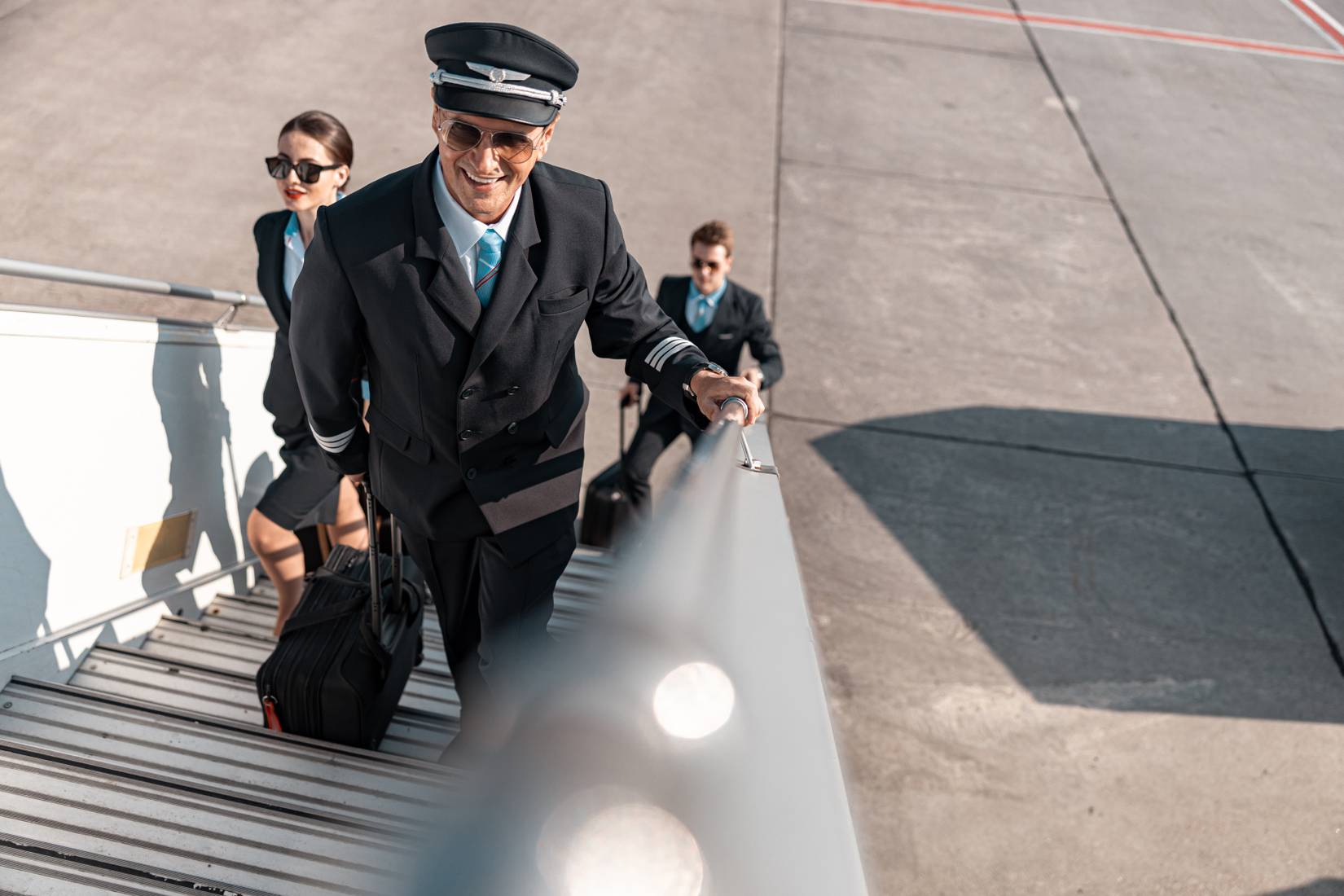 Airline pilots and crew members boarding an aircraft