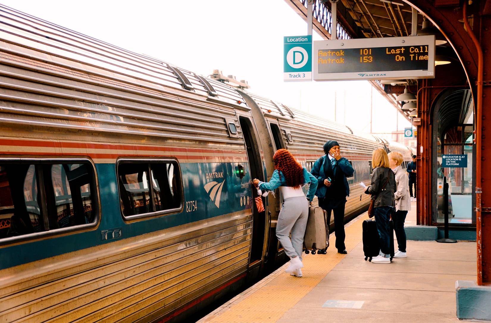 Passengers boarding on an Amtrak train at the station platform