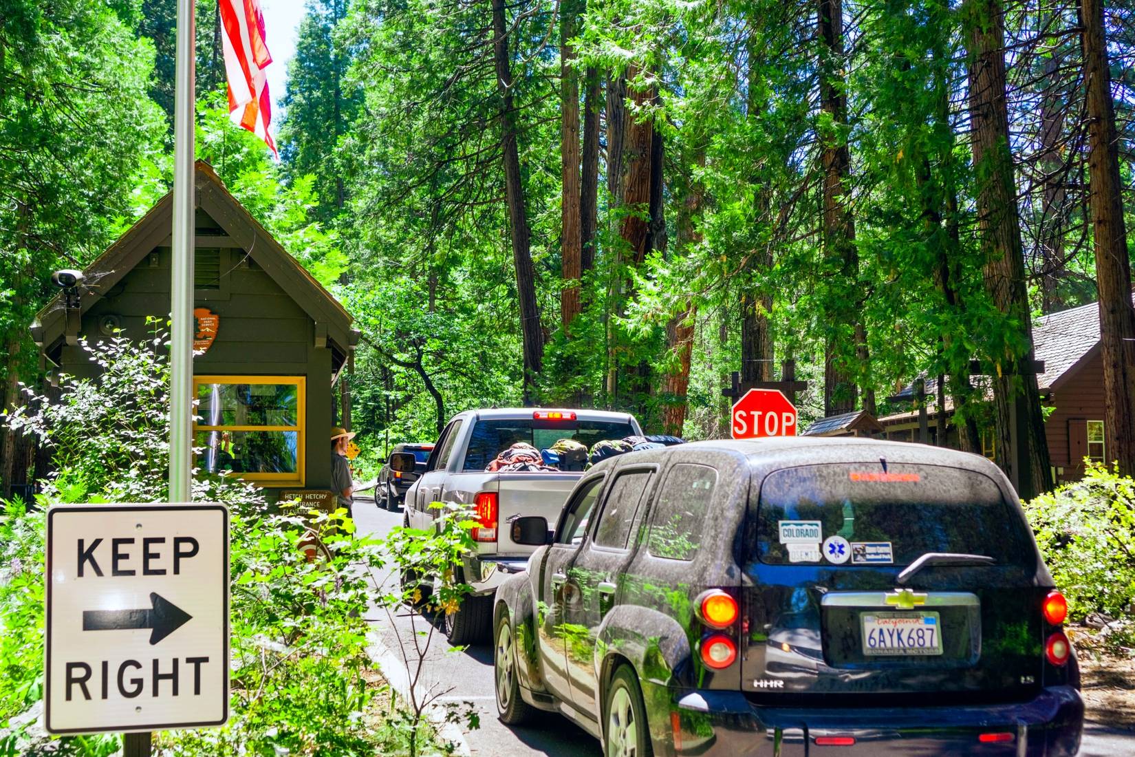 Lines of vehicles queueing to get into Yosemite National Park entrance, CA, California, USA