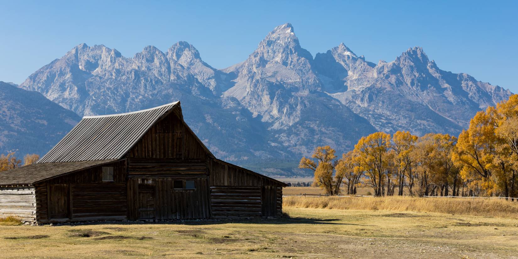 Moose, Wyoming USA - October 10, 2020: Thomas A. Moulton Barn near Mormon Row at Antelope Flats Road on Moose, Wyoming. The Grand Teton Mountains create a beautiful background.