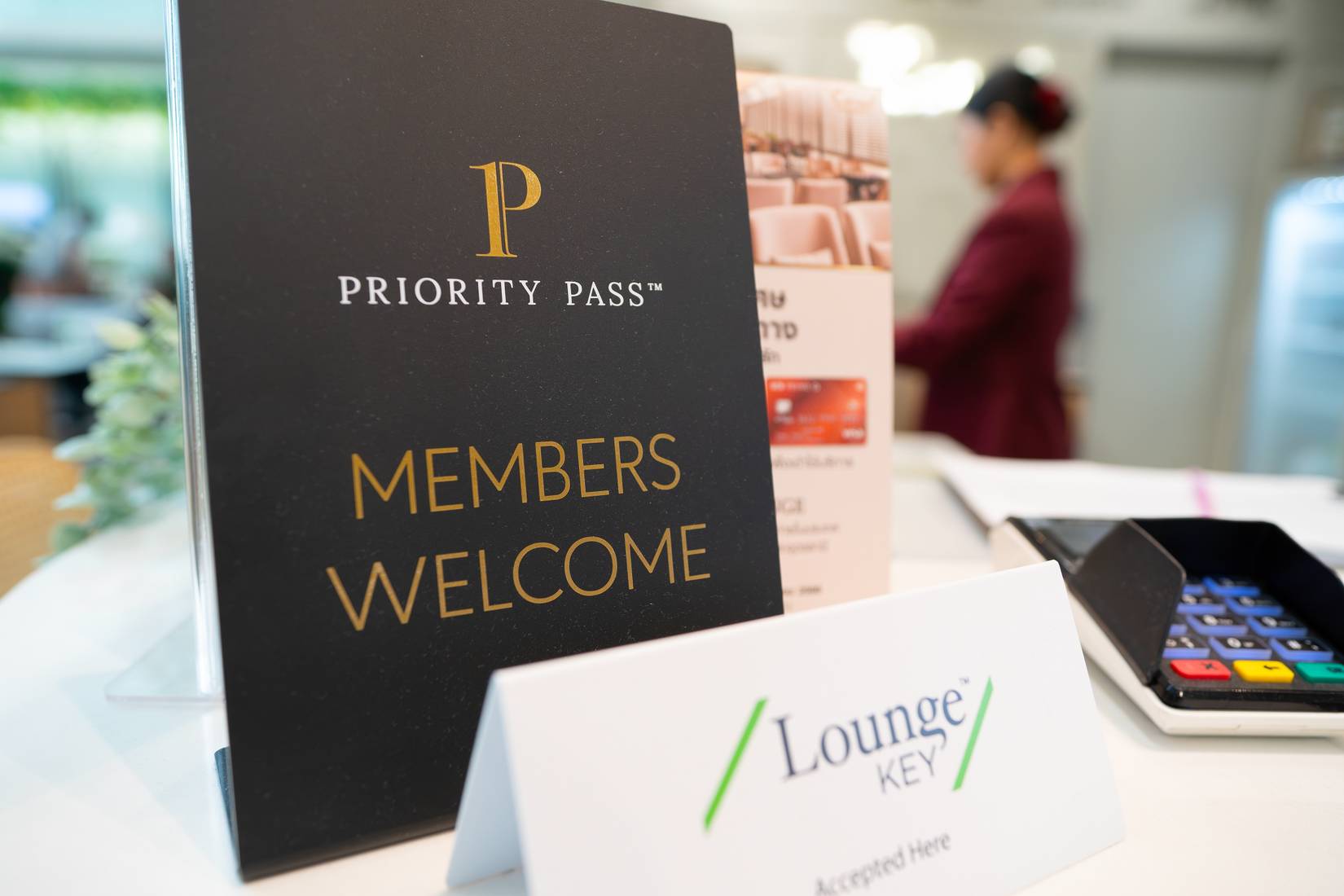 A close-up view of the Priority Pass sign as seen at the Coral Premium Lounge at Suvarnabhumi Airport in Bangkok, Thailand.