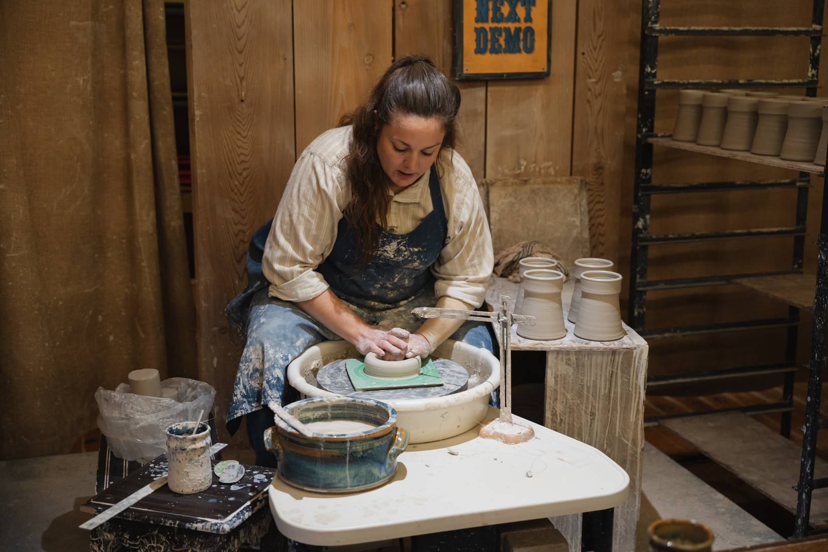 A potter molds clay at Silver Dollar City