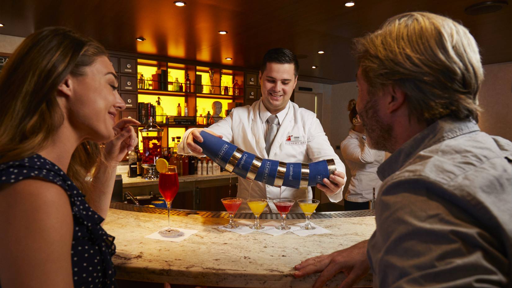 A bartender pours drinks aboard the Carnival Glory cruise ship