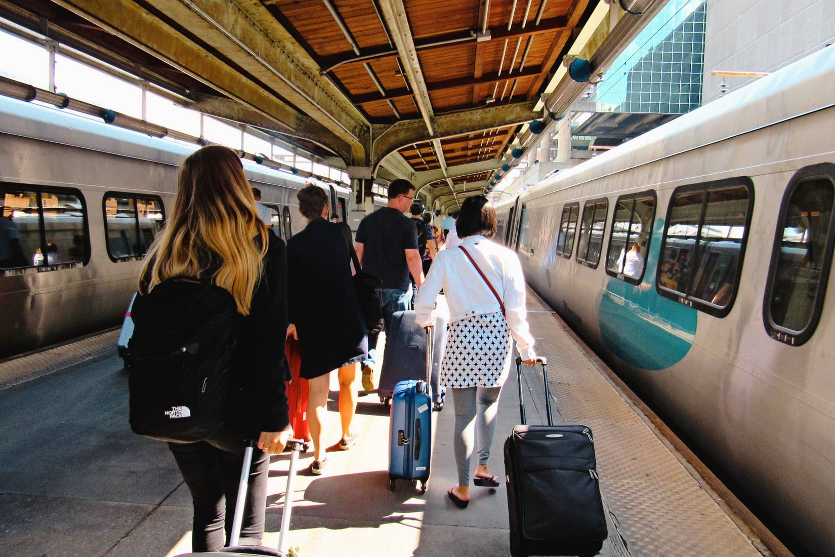 Arriving Acela train passengers walk down the platform toward the main concourse at Washington Union Station