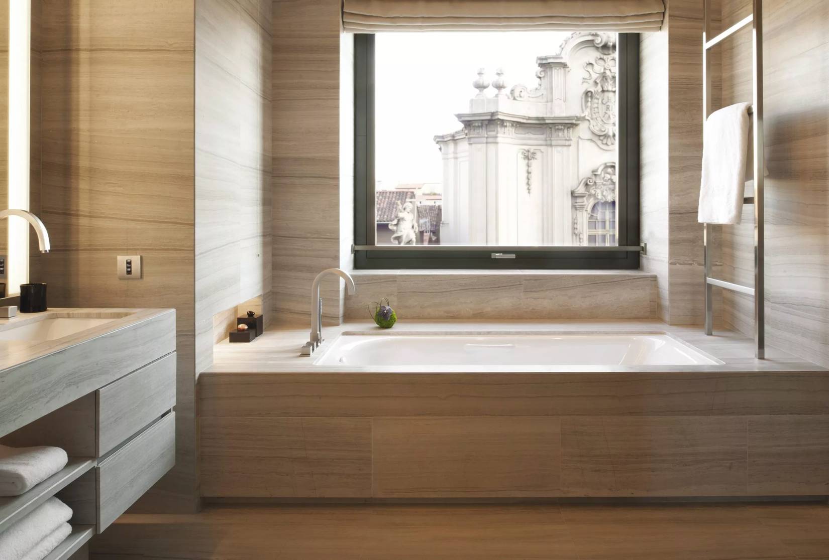 A bathroom in the Armani Hotel, with views of Milan, Italy, out the window