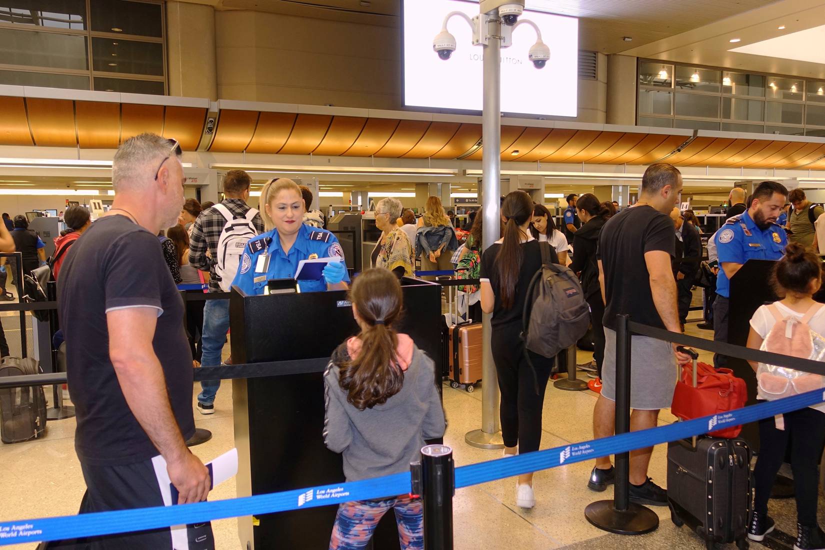 People at TSA security passport checkpoint at Los Angeles International Airport