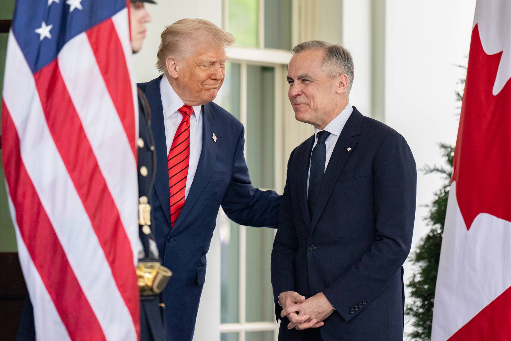President Donald Trump greeting Prime Minister of Canada Mark Carney at the West Wing entrance of the White House