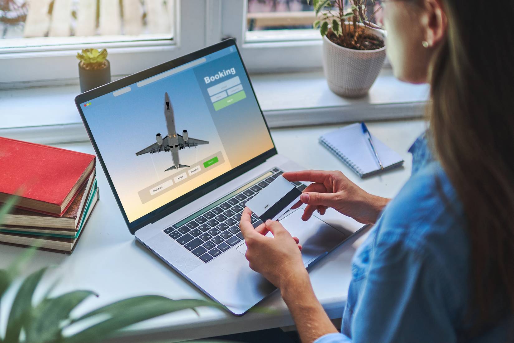Online booking and buying plane tickets using a computer and a credit card