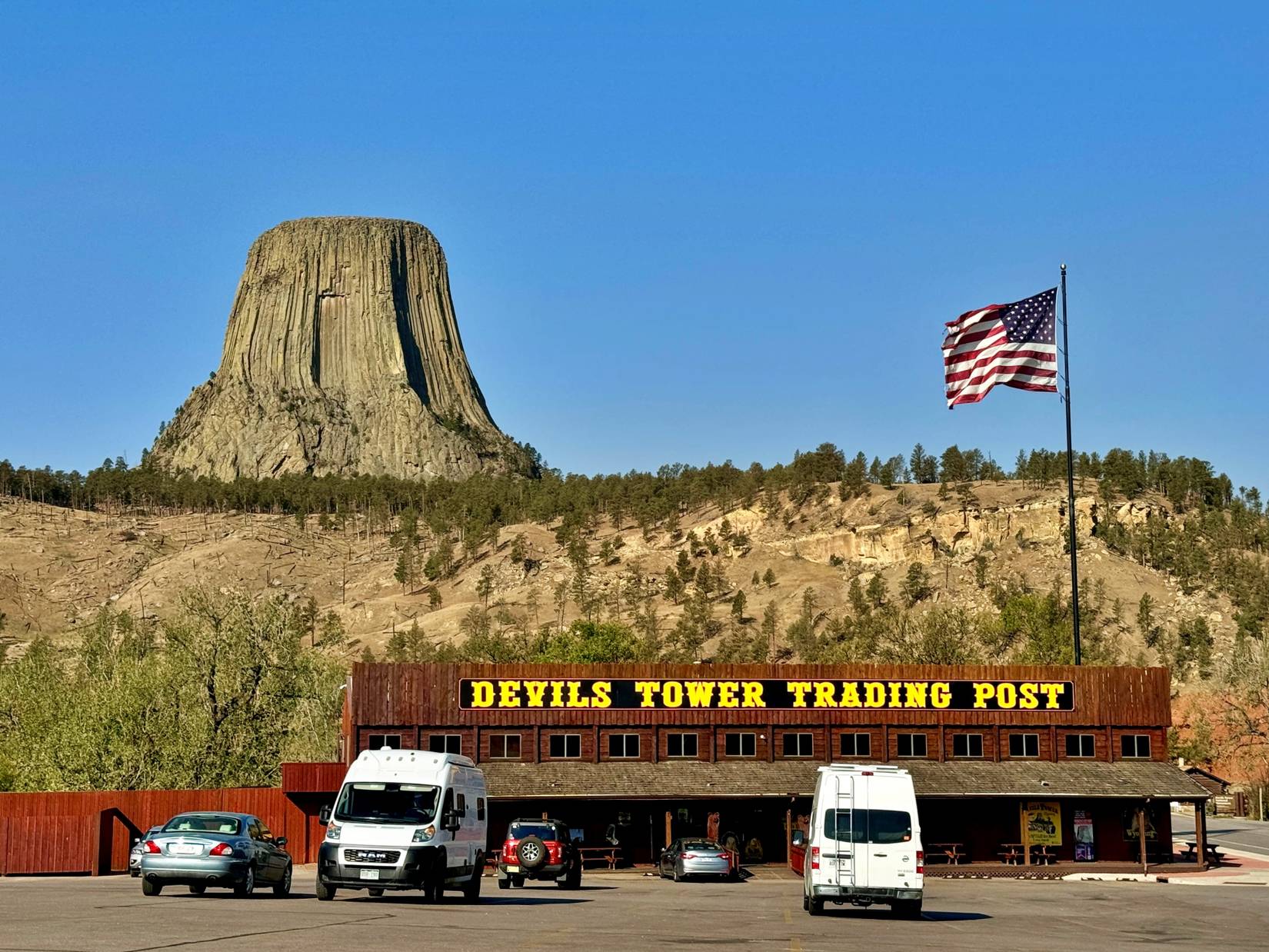 Devil's Tower rising behind the Devils Tower Trading Post in Wyoming