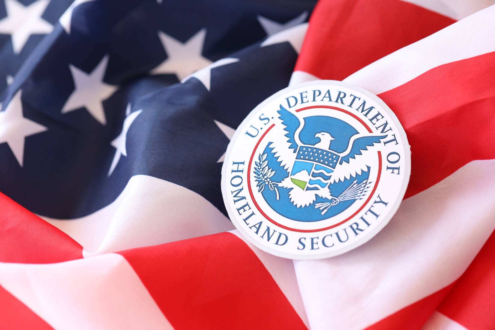 US Department of Homeland Security seal on the flag of the United States of America