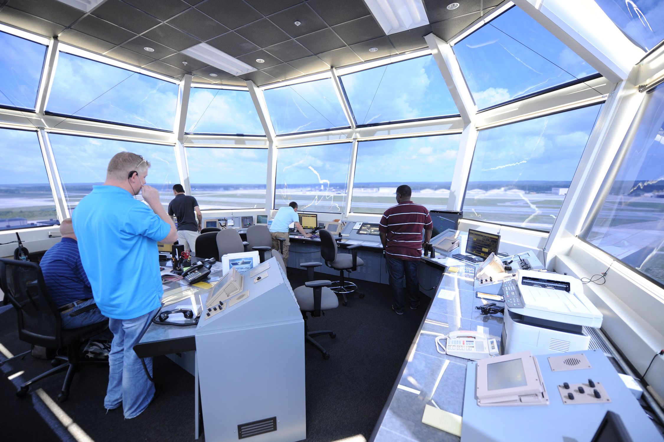 Air traffic controllers direct air and ground operations in the air traffic control tower at Pope Field, North Carolina, NC, USA