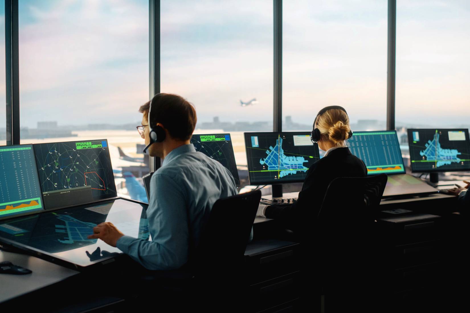 Air traffic control team working in an airport tower.