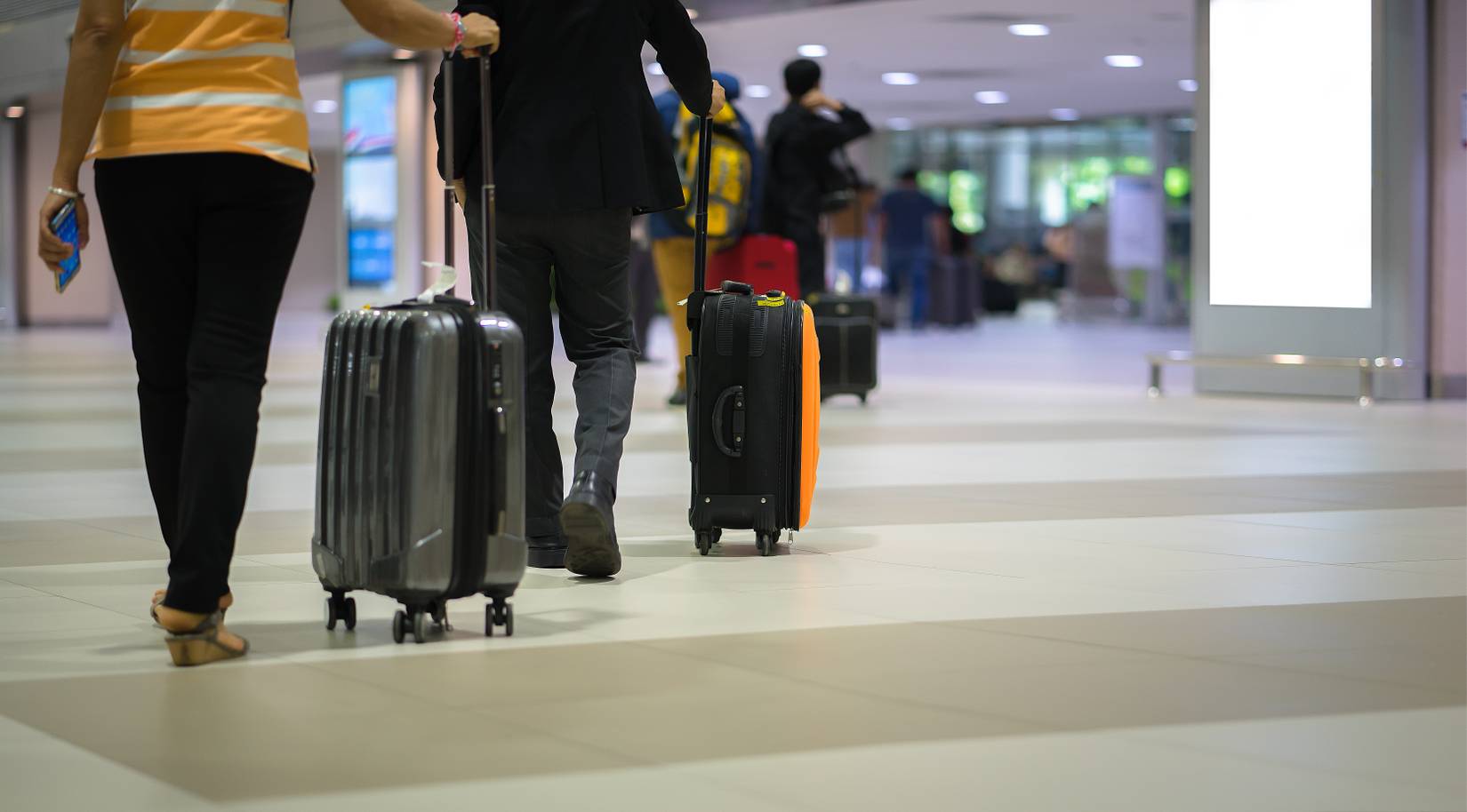 Travelers With Suitcase