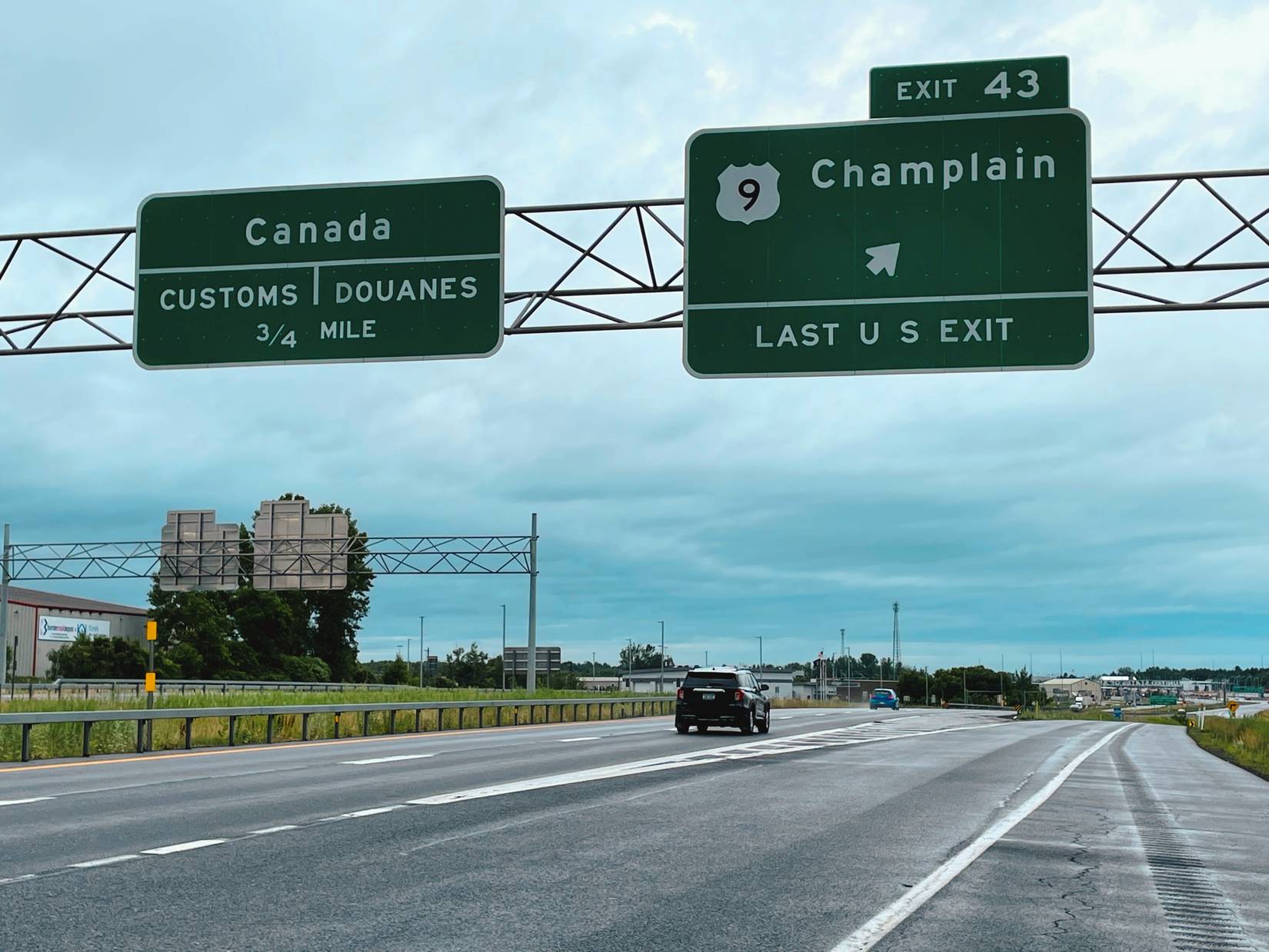 Car on the interstate highway in Champlain, New York, heading towards customs on the Canadian border
