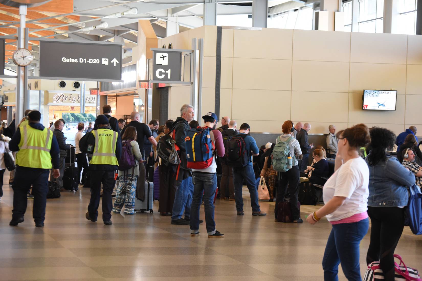 A large crowd of travelers waiting at their gate at Raleigh-Durham International Airport, North Carolina, U.S.