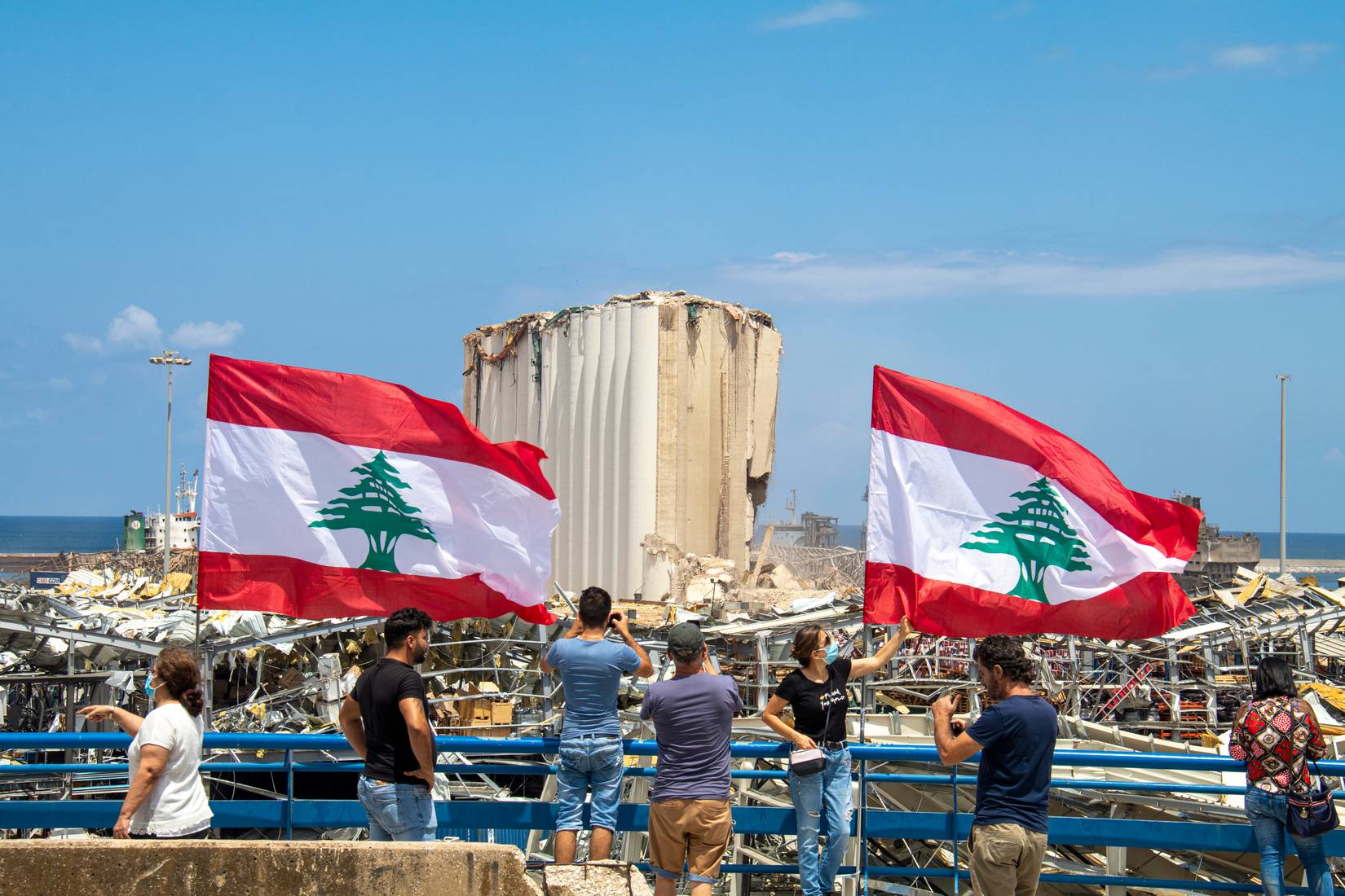 Lebanese flag at the scene of a massive blast in Beirut