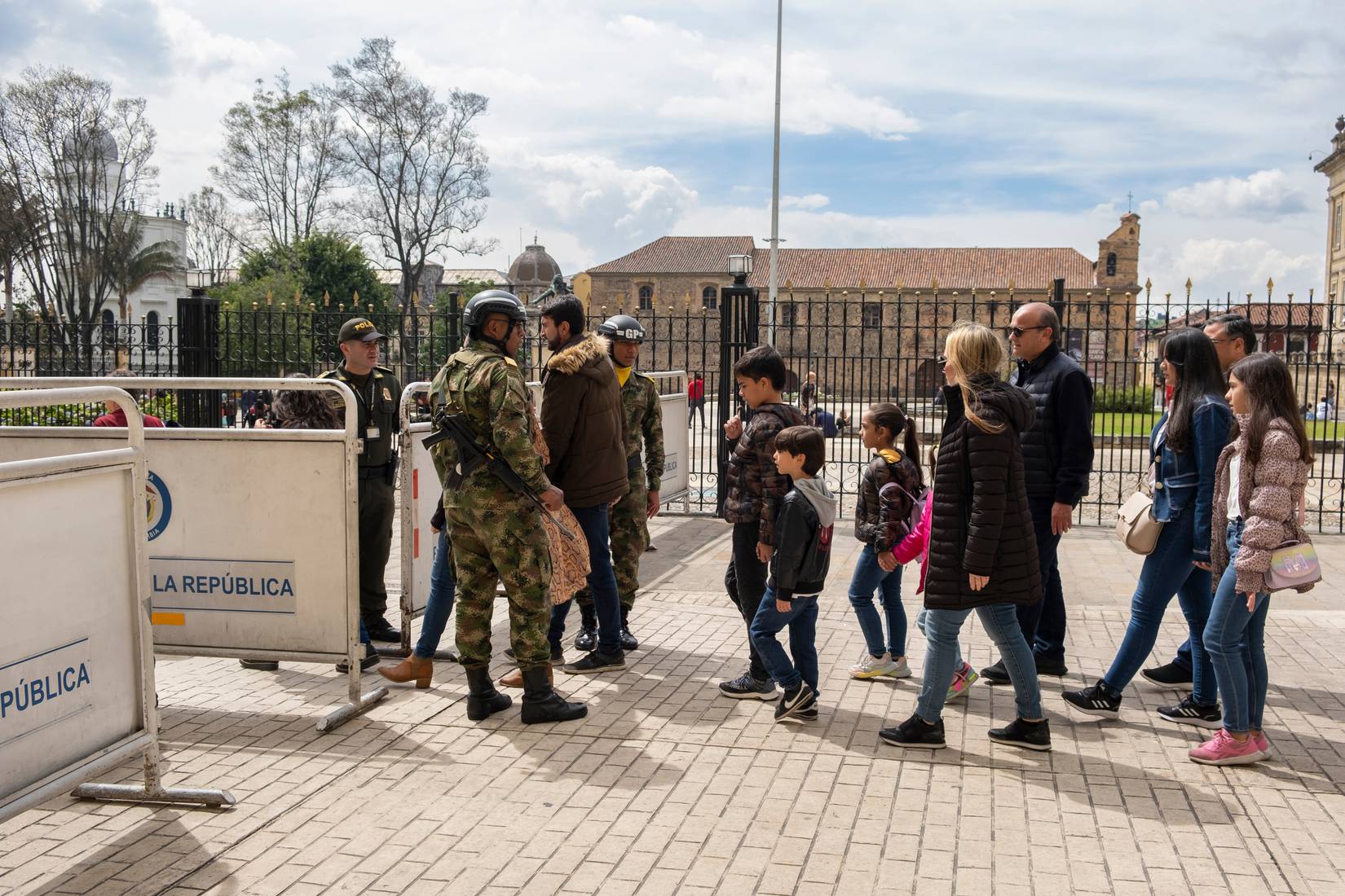Police officers, national guards, and military checking tourists and visitors in La Candelaria, Bogotá, Colombia