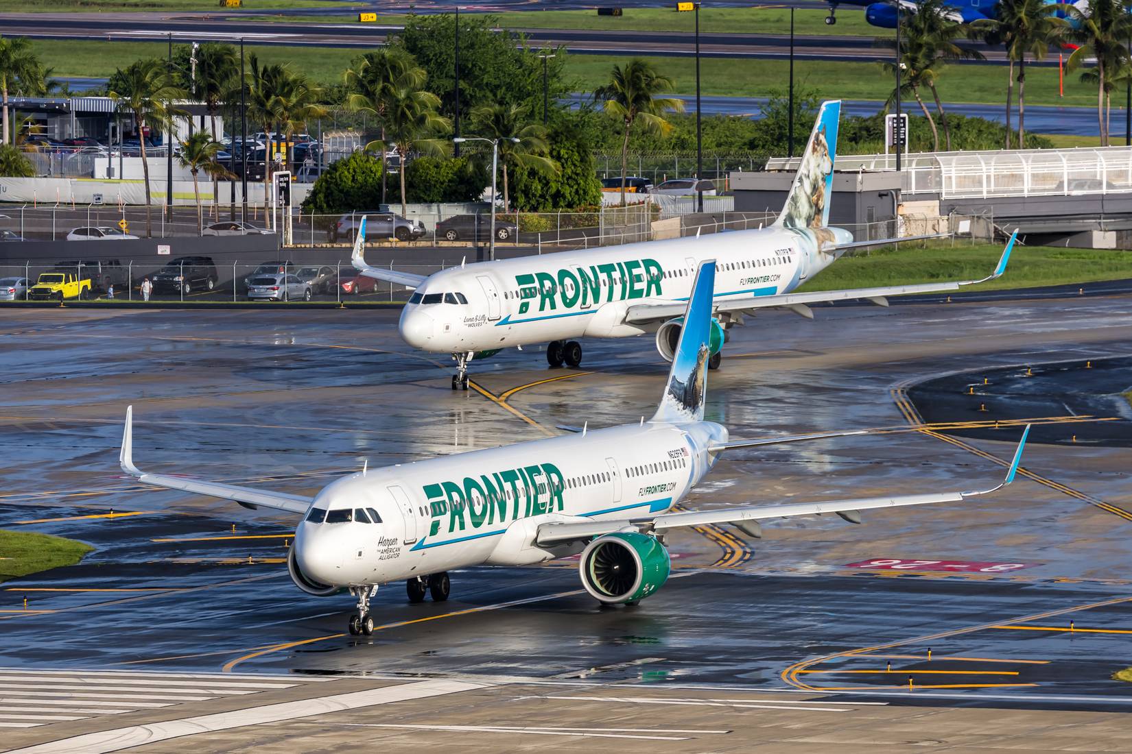 Two Frontier Airlines planes at San Juan airport in Puerto Rico