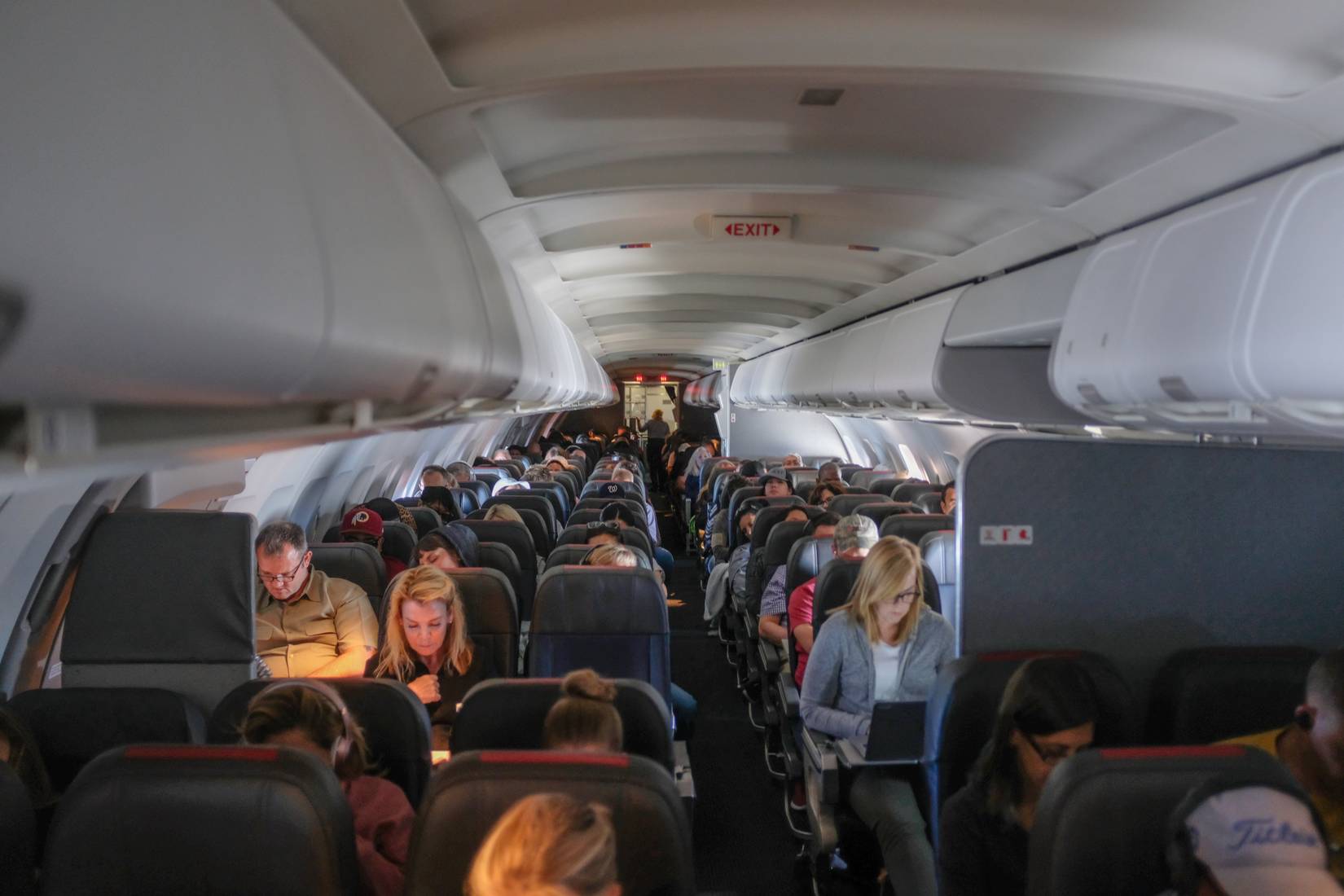 Passengers in the interior cabin of an American Airlines airplane
