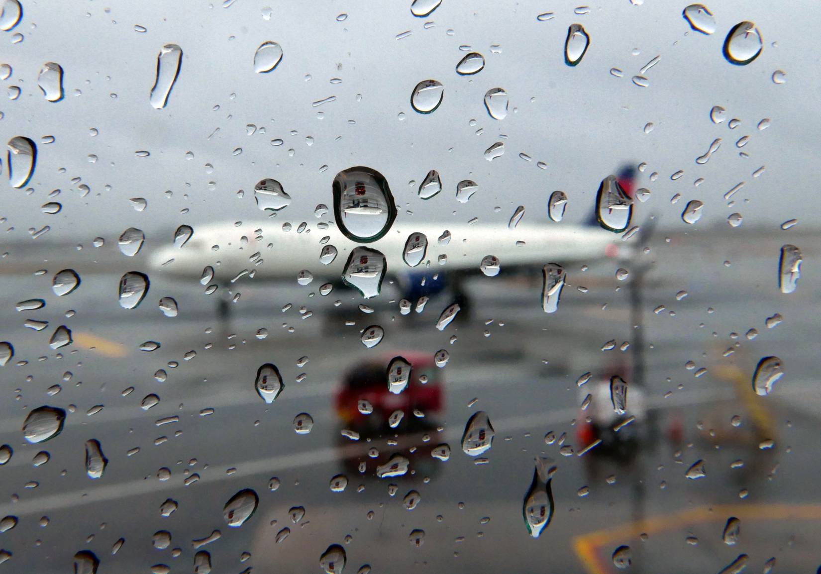 Rainy window looking out at Chicago O’Hare International Airport, Chicago, Illinois