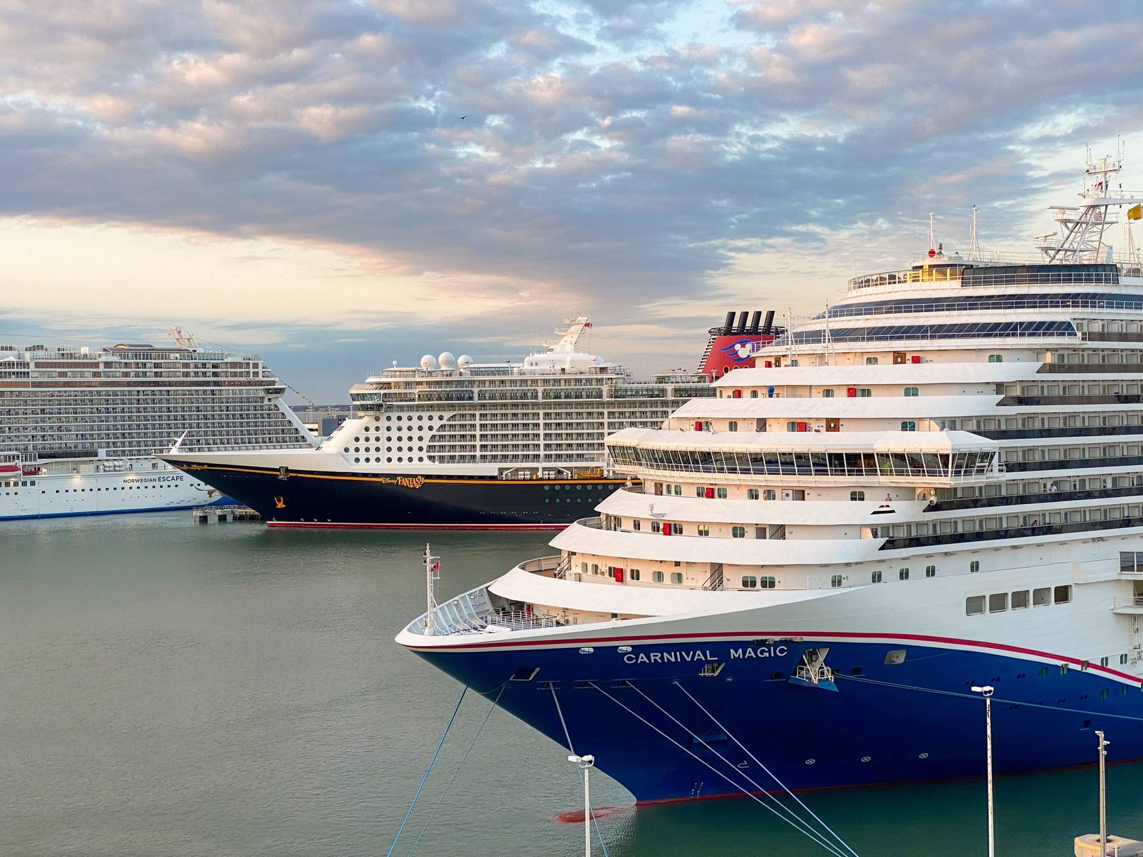 Carnival Magic, Disney Fantasy, and Norwegian Escape Cruise ships at the Cruise Terminal in Port Canaveral, Florida