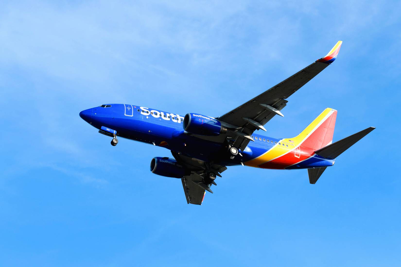 Southwest Airlines plane in the air with blue sky