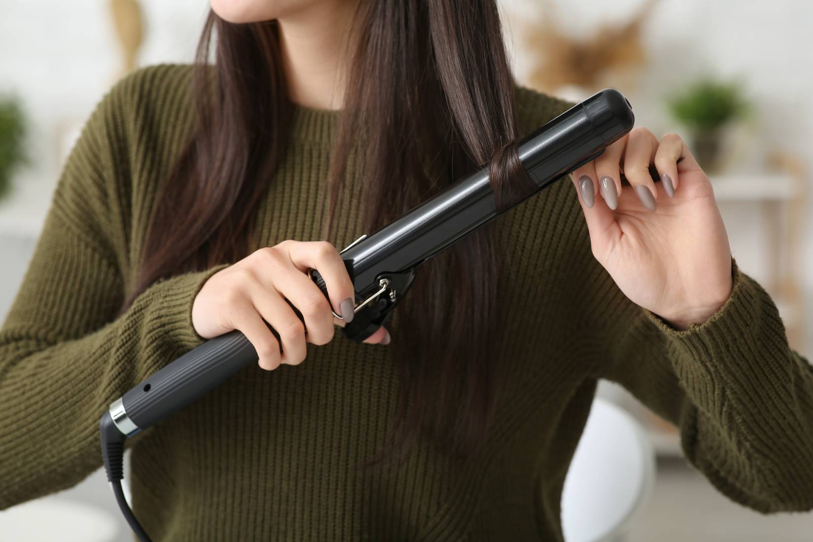 Woman with curling iron