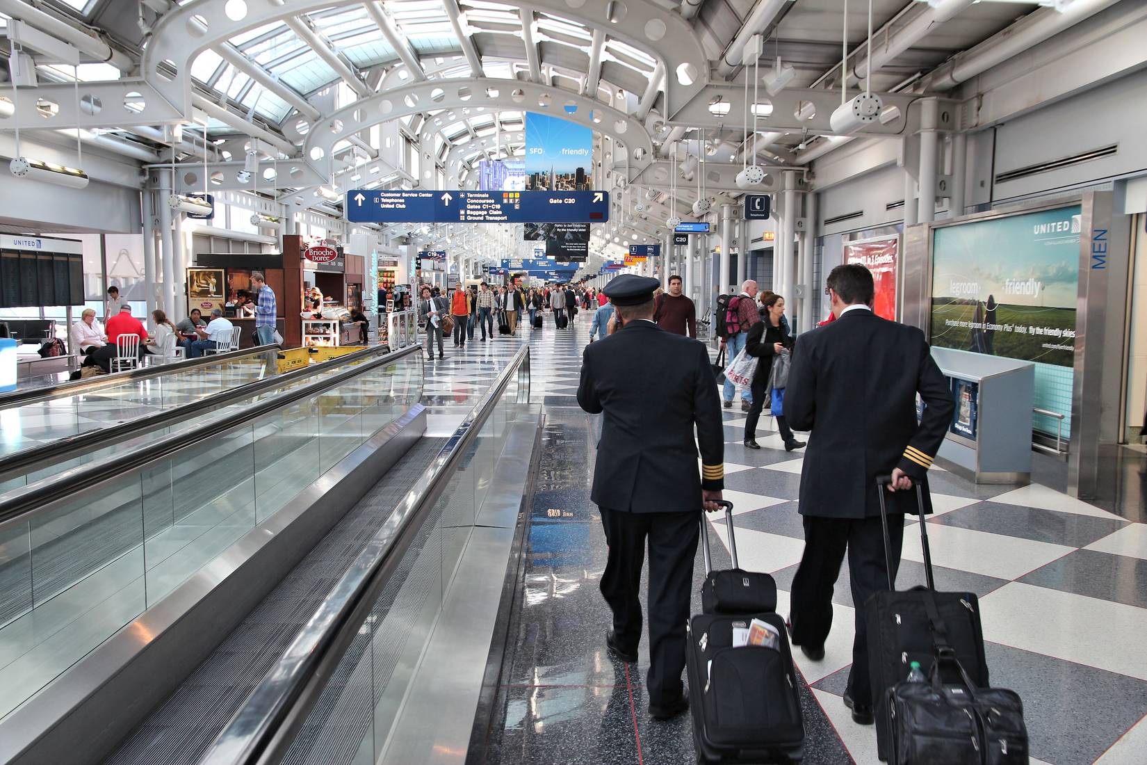 Pilots walking to gate at Chicago O'Hare International Airport in USA