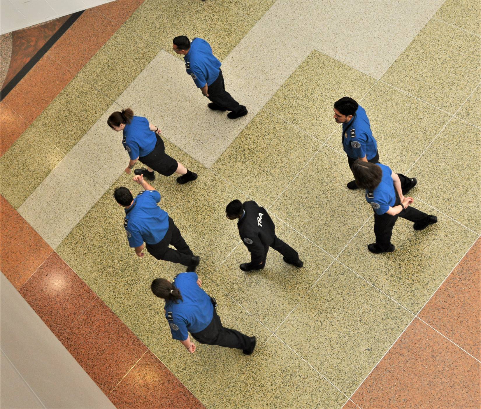 Transportation Security Administration TSA agents walking through a US airport