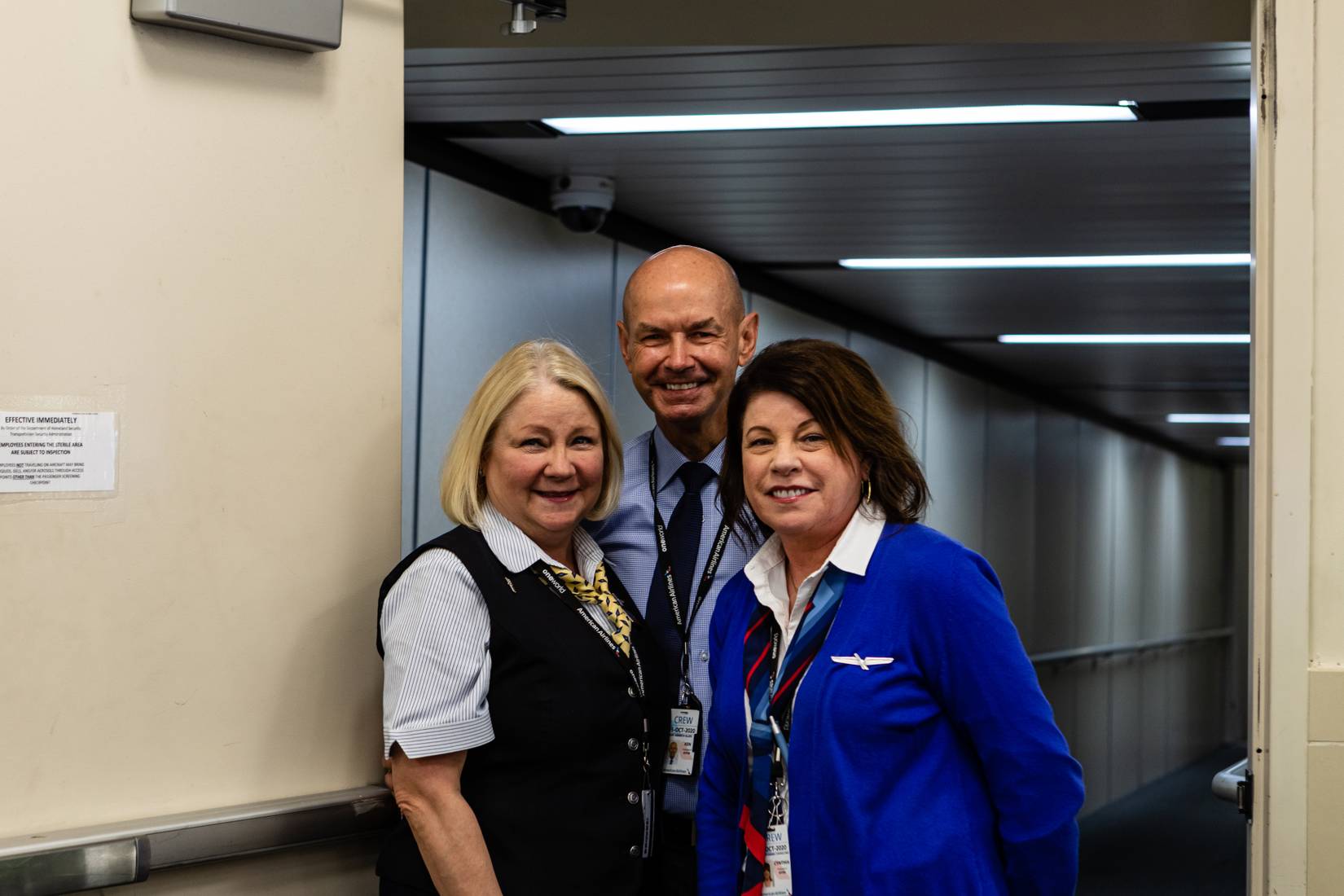 American Airlines flight attendants and cabin crew in uniform on an aircraft