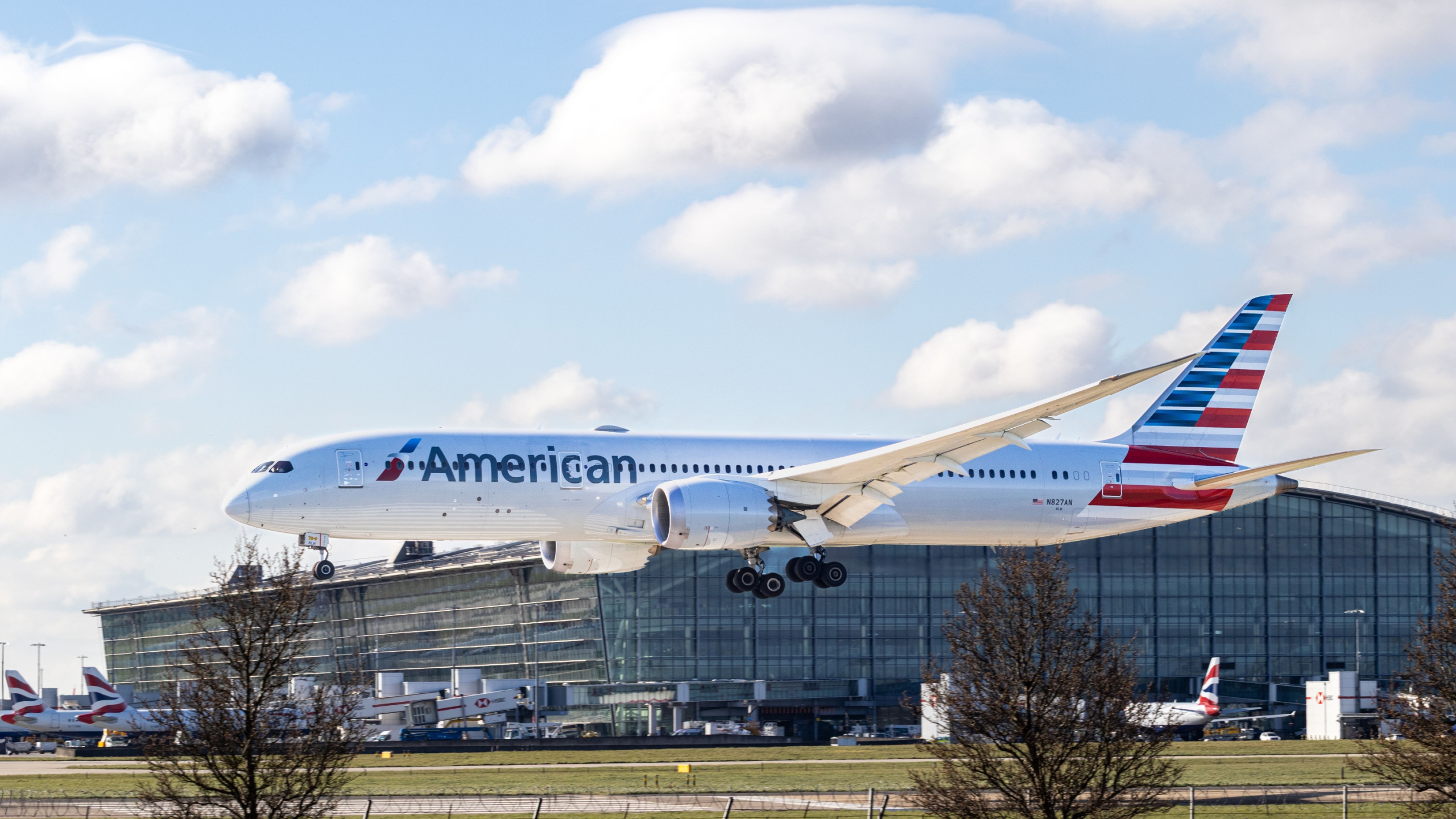 American Airlines. The aircraft is landing runway 09L at London Heathrow UK