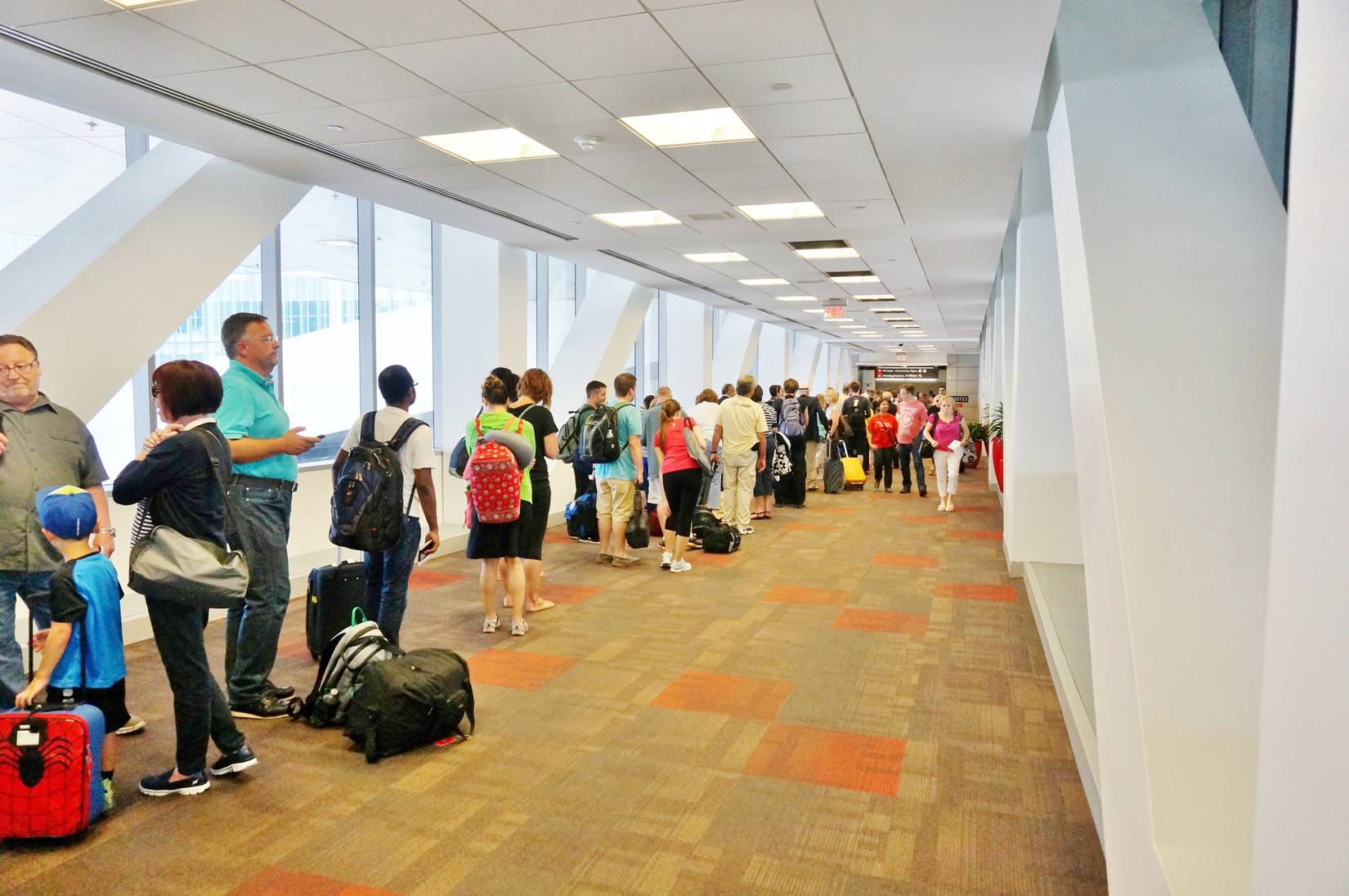 Passengers wait in line at TSA security in Terminal A at Philadelphia International Airport USA