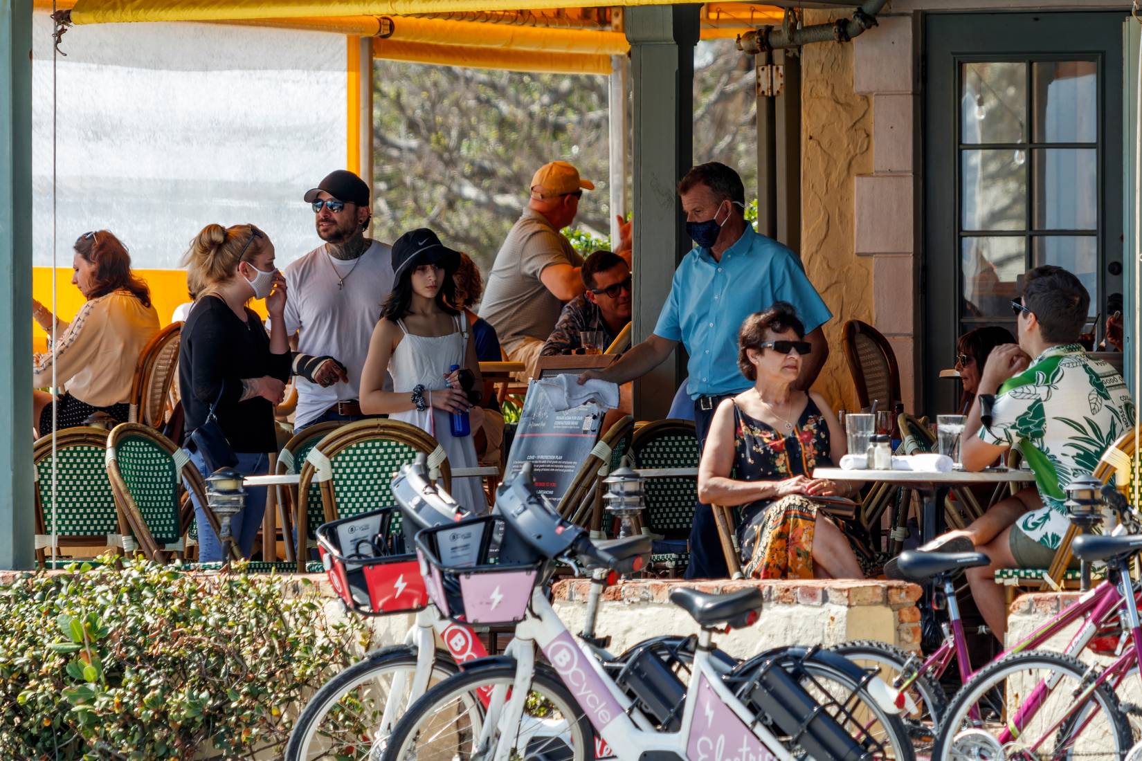 People sitting at a cafe restaurant on the terrace in Fort Lauderdale Beach, Florida, USA