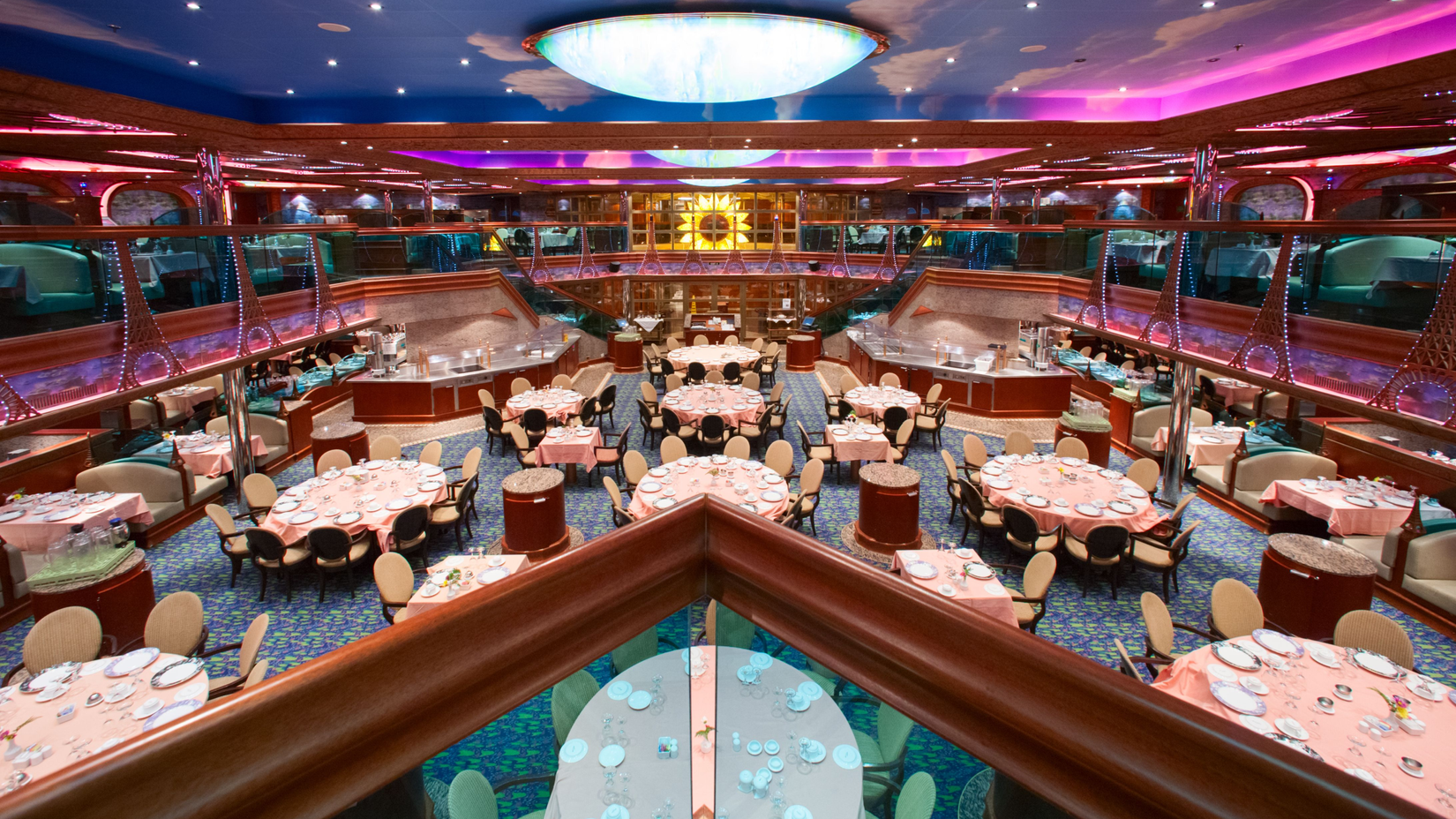 A wide-shot view of Renoir Forward Restaurant from the second floor in Carnival Conquest ship
