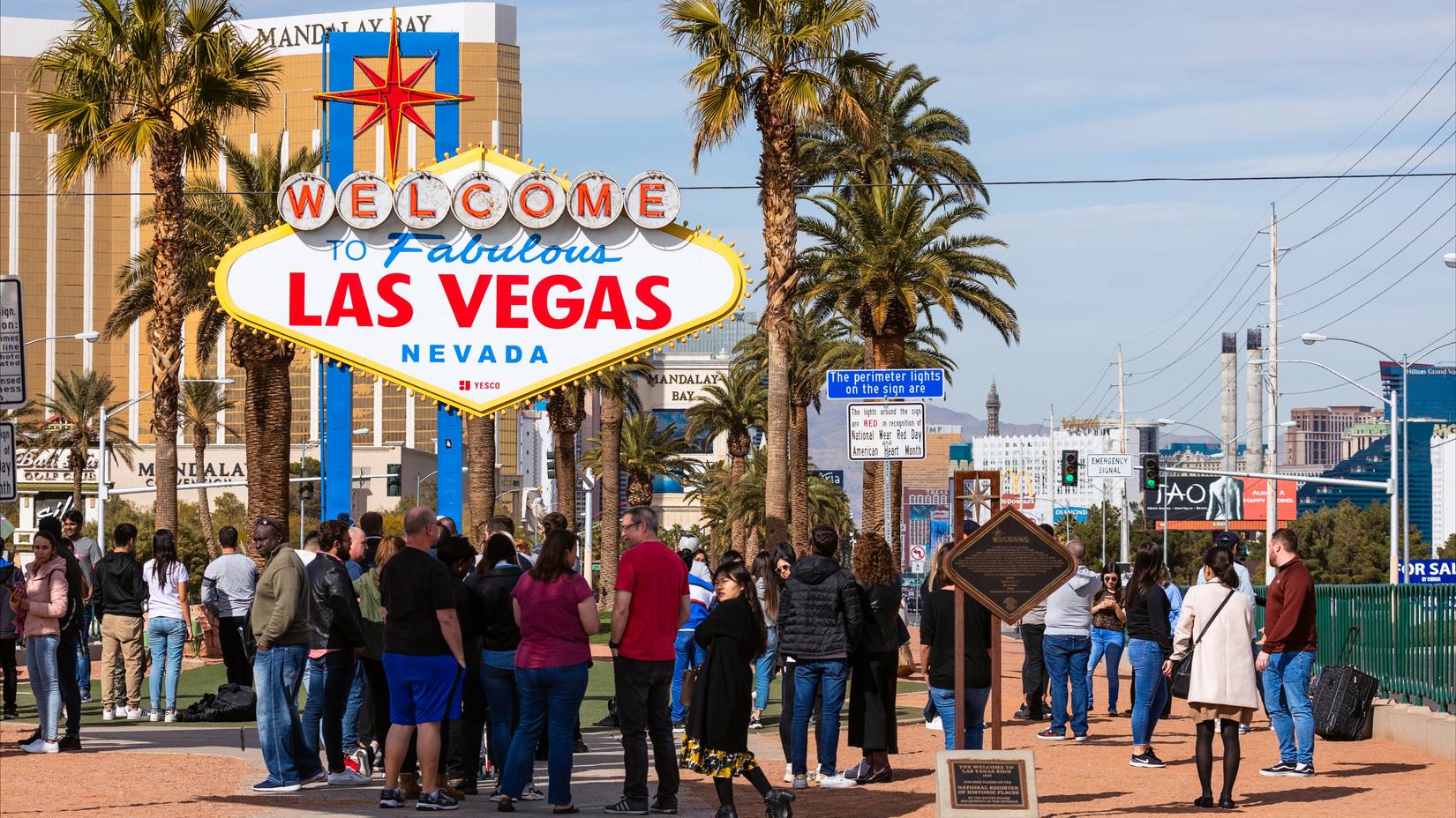 A crowd of tourists standing in line for photos at the Welcome to Fabulous Las Vegas sign, Las Vegas, Nevada