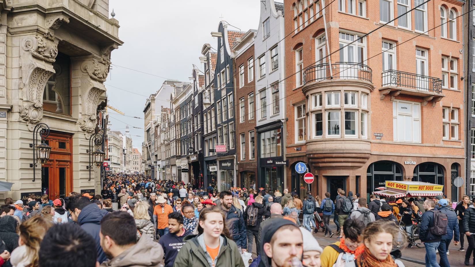 Many tourists walking in the center of Amsterdam, the capital of the Netherlands