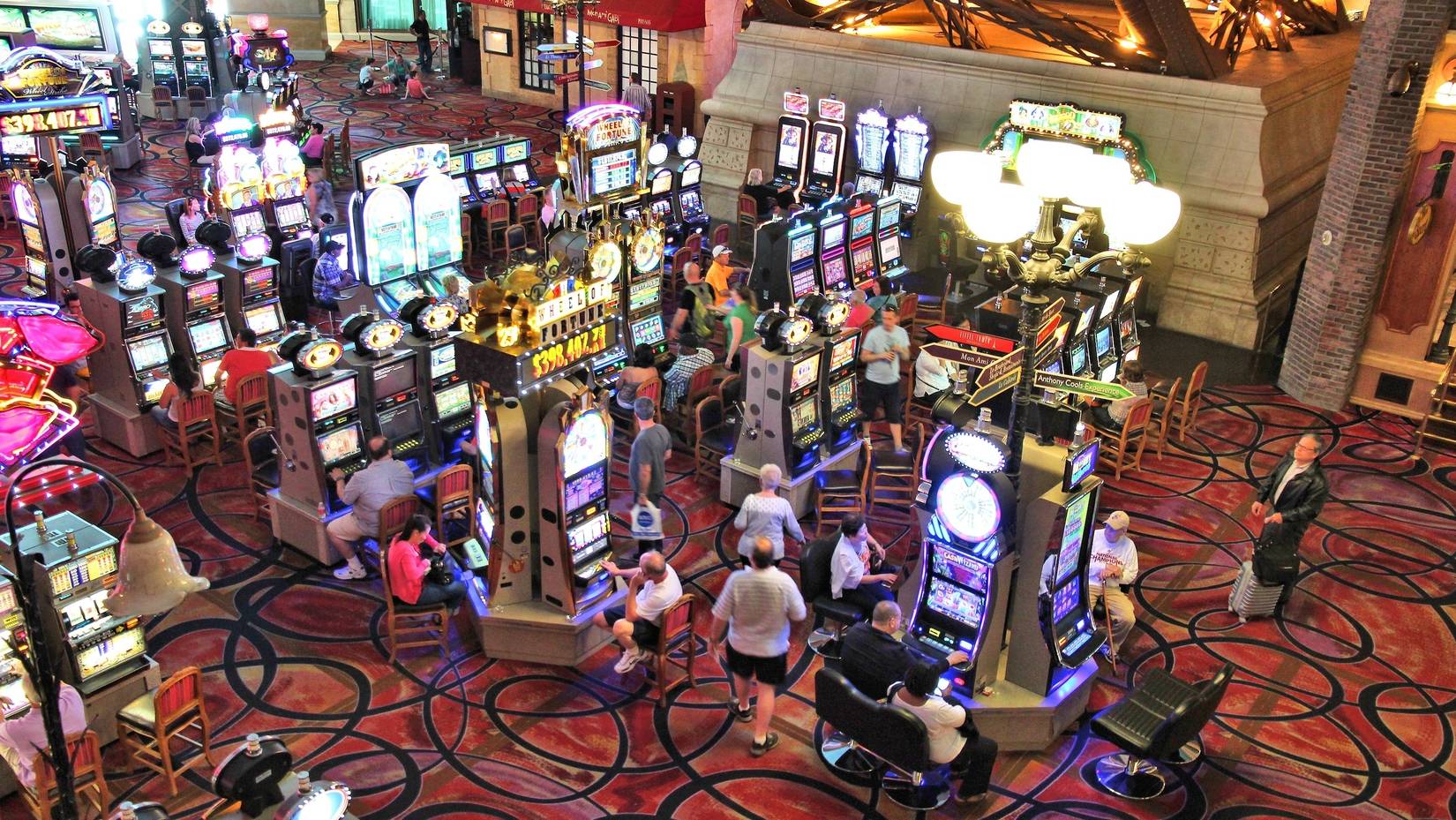 People play slot games at the Paris Las Vegas casino, Las Vegas, Nevada