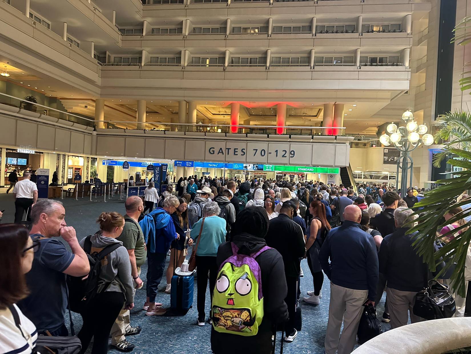 Travelers at a Transportation Security Administration TSA at Orlando International Airport in Florida