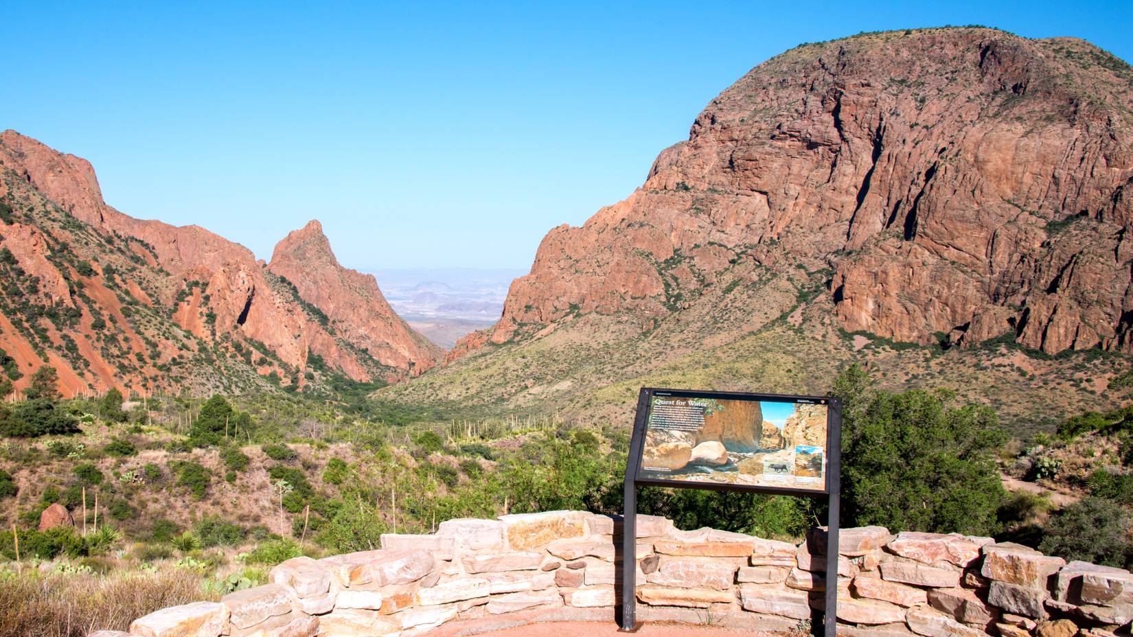 Scenic landscape at Big Bend National Park, with sign in the front. 